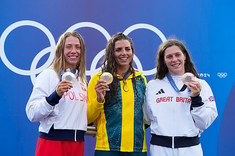 Women's kayak single medal ceremony: Silver medalist Poland's Klaudia Zwolinska Gold medalist Australia's Jessica Fox, and bronze medalist Britain's Kimberley Woods